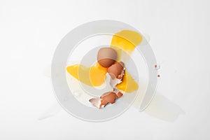 Raw broken egg on white background, top view