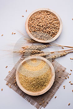 Raw Broken Wheat or Daliya or Dalia, selective focus