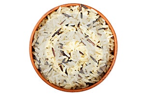 raw brown rice in a clay plate