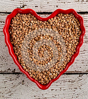 Raw Buckwheat in Red Heart Shaped Bowl