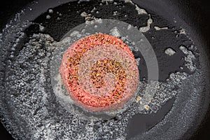 Raw Burger in a Cast Iron Skillet