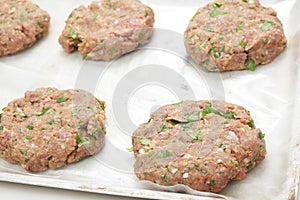 Raw burger patties