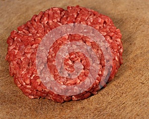 Raw burger patty