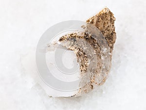 raw cacholong (white opal) stone on white photo