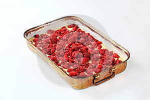 Raw cake batter with raspberries