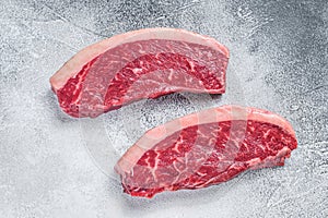 Raw cap rump or top sirloin beef meat steak. White background. Top view