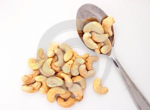 Raw cashew nuts pile in spoon