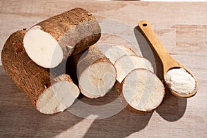 Raw cassava starch - Manihot esculenta. Wood background