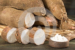 Raw cassava starch - Manihot esculenta. Wooden background