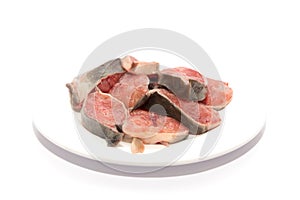Raw catfish in plate on white background