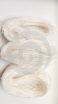 Raw cellophane noodles, glass noodles (soun) isolated on white background