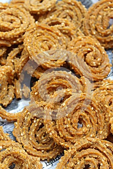 Raw chakali in plate. Indian Traditional Tea Time Snack Chakli, a deep fried snack, It is known as Chakali, Murukku, Muruku,