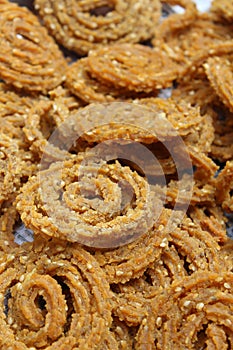 Raw chakali in plate. Indian Traditional Tea Time Snack Chakli, a deep fried snack, It is known as Chakali, Murukku, Muruku,