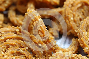 Raw chakali in plate. Indian Traditional Tea Time Snack Chakli, a deep fried snack, It is known as Chakali, Murukku, Muruku,