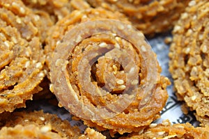 Raw chakali in plate. Indian Traditional Tea Time Snack Chakli, a deep fried snack, It is known as Chakali, Murukku, Muruku,