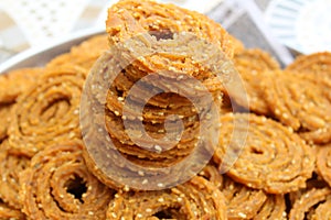 Raw chakali in plate. Indian Traditional Tea Time Snack Chakli, a deep fried snack, It is known as Chakali, Murukku, Muruku,