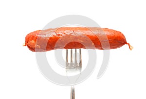 Raw cheese kransky hotdog on fork