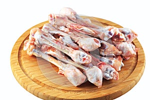 Raw chicken bones on a white background