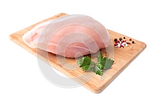 Raw chicken Breasts and spices on wood chopping Board isolated on white