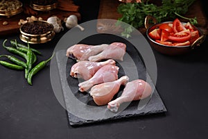 Raw chicken drum stick or leg pieces