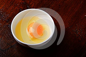 Raw chicken egg in the bowl