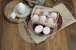 Raw chicken eggs in authentic egg box on a kitchen