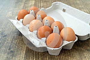 Raw chicken eggs in egg box