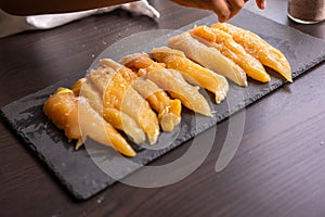 Raw chicken fille closeup on the kitchen table photo