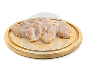 Raw Chicken fillet on hardboard photo