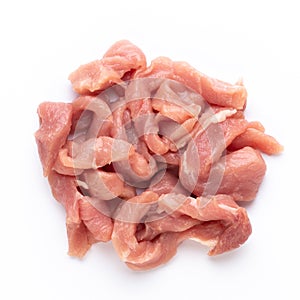 Raw chicken fillet. Small pieces of meat isolated on white