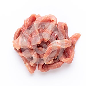 Raw chicken fillet. Small pieces of meat  on white