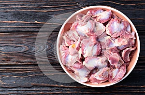 Raw chicken giblets gizzard ( stomach ) , meat background