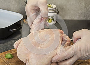 Raw chicken on kitchen table ready to be cut and cook