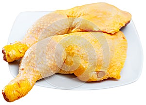 Raw chicken legs isolated over white