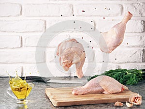 Raw chicken legs levitation. Food ingredient.