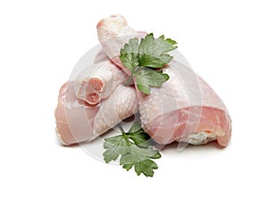 Raw chicken legs on white background