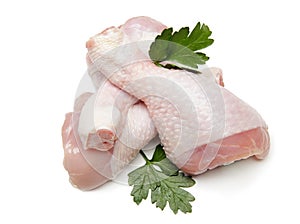 Raw chicken legs on white background