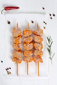 Raw chicken ot turkey meat skewers from above