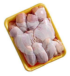 Raw chicken parts set in a tray isolated