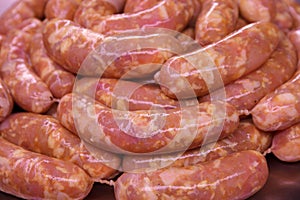 Raw chicken sausages close up for frying