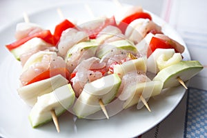 Raw chicken skewers