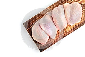 Raw chicken thigh isolated on white background
