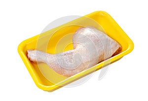 Raw chicken thigh in plastic container isolated on white background with clipping path