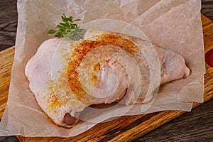 Raw chicken thigh with spices