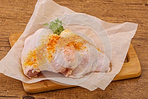 Raw chicken thigh with spices