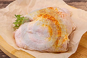 Raw chicken thigh with spices