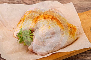 Raw chicken thigh with spices