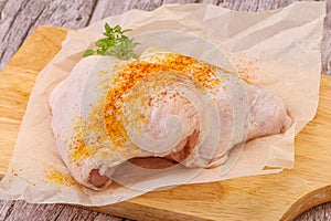 Raw chicken thigh with spices