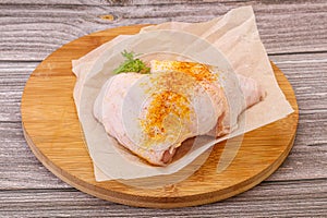 Raw chicken thigh with spices