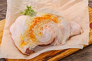 Raw chicken thigh with spices